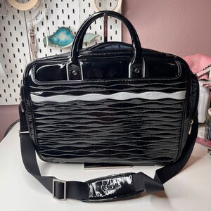 Tumi black patent leather business briefcase with a detachable shoulder strap